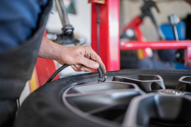 A shot of an unrecognizable mechanic changing valve.